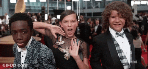 Young People Standing On Red Carpet GIF
