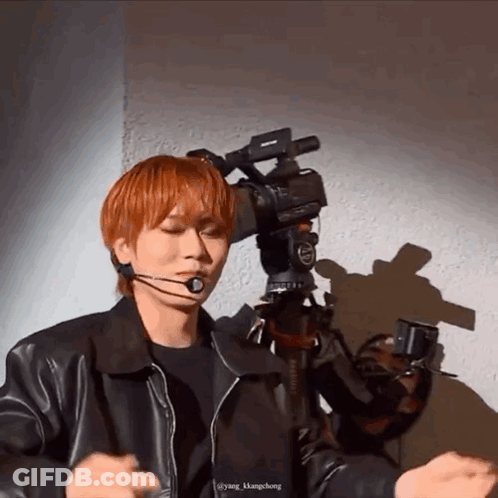Young Red-Haired Man Facing Camera GIF