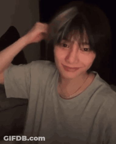Young Woman Brushing Hair With Comb Smiling GIF