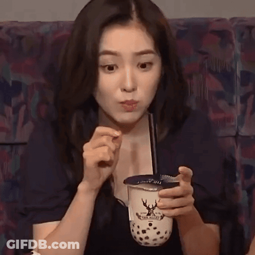 Young Woman Holding Bubble Tea GIF