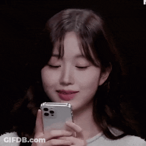 Young Woman Holding Cell Phone GIF