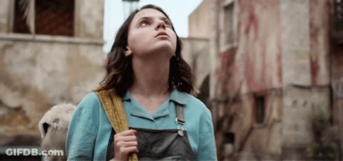 Young Woman Holding Stuffed Animal Looking Up GIF