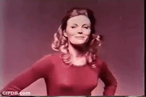 Young Woman In Black Bra And Green Shorts GIF