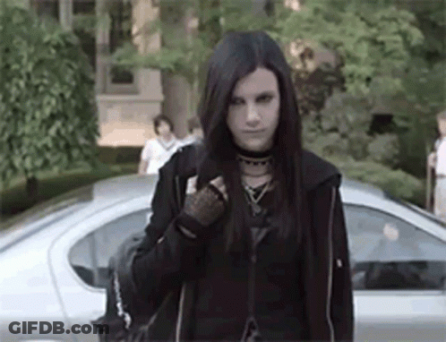 Young Woman In Black Jacket Standing In Front Of Car GIF