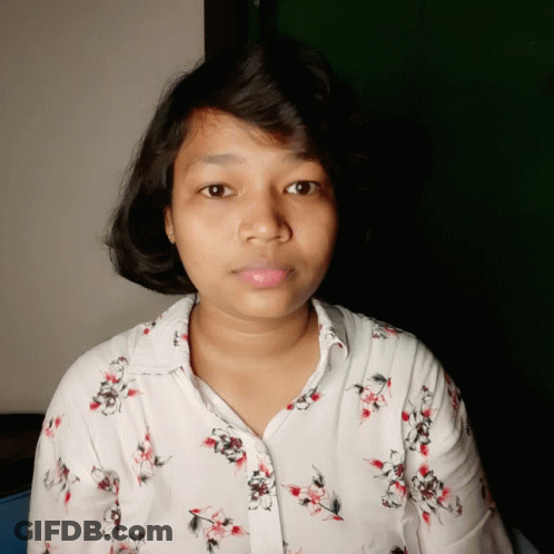 Young Woman In Floral White Shirt GIF