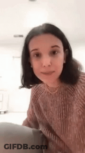 Young Woman In Pink Sweater GIF