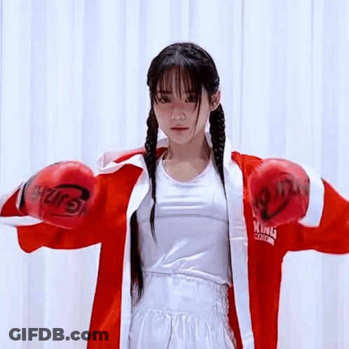 Young Woman In Red Boxing Gloves And Red Robe GIF