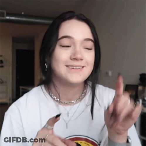 Young Woman In White T-Shirt Giving Middle Finger GIF