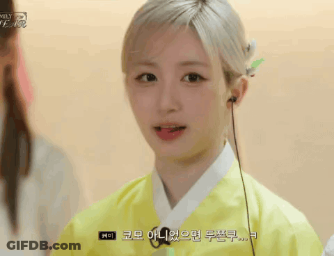 Young Woman In Yellow Kimono With Headphones Talking GIF