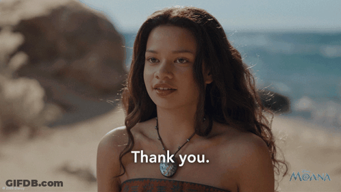Young Woman Saying Thank You In Front Of Moana Poster GIF