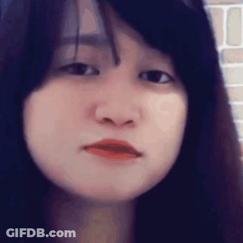 Young Woman Serious Close Up GIF