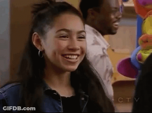 Young Woman Smiling Next To Man GIF