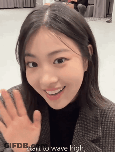 Young Woman Smiling Waving Start To Wave High GIF