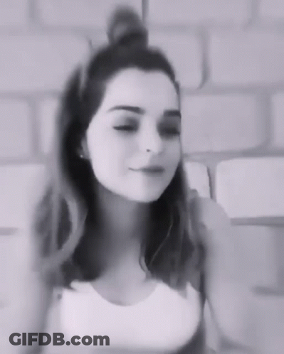 Young Woman With Bun In Black And White GIF