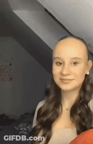 Young Woman With Long Hair And Bald Head GIF