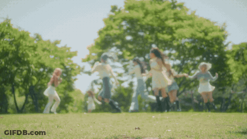 Young Women Dancing In Park GIF