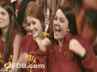 Young Women In Red Shirts Cheering In Stadium GIF