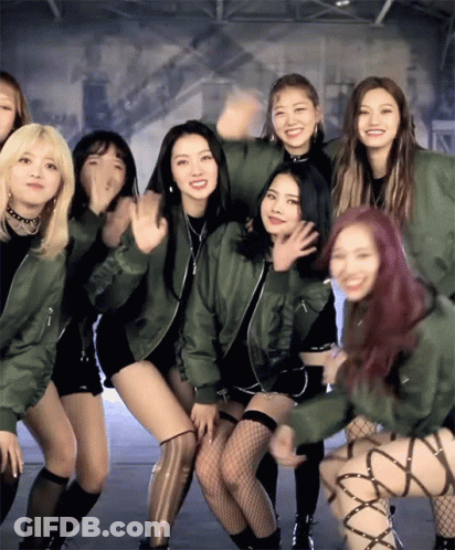 Young Women Posing One In Green Jacket GIF
