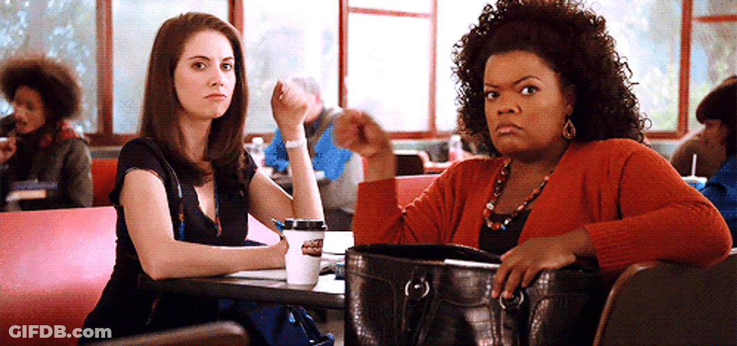 Yvette Nicole Brown And His Friend Fist Bump While Waiting GIF