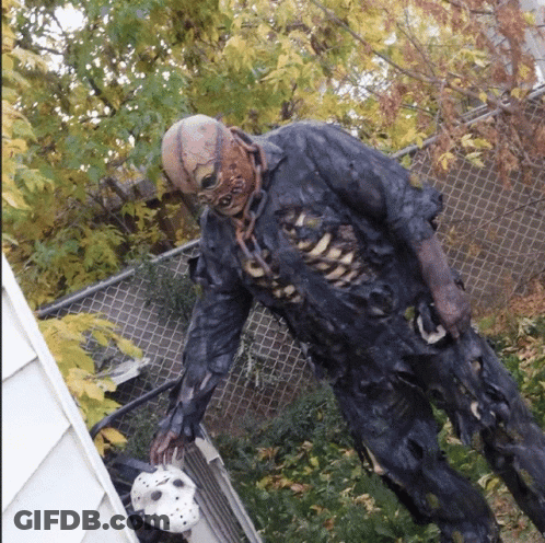 Zombie Statue Holding Hockey Mask GIF