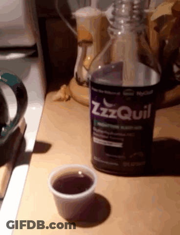 ZzzQuil Bottle Next To Cup GIF