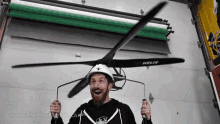 Funny Guy Flying Using Helicopter Propeller GIF 