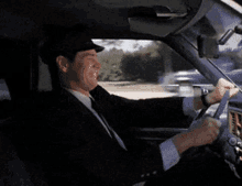 Lloyd Christmas Jim Carrey Driving Car Got Worms GIF | GIFDB.com