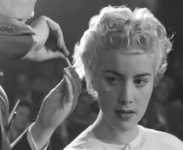 1950s Fixing Hair GIF.
