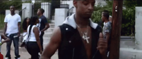 21 Savage Holding Cup While Walking GIF