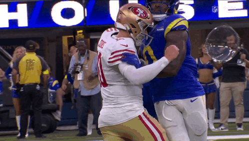 49ers Football Player Hugging Another Player