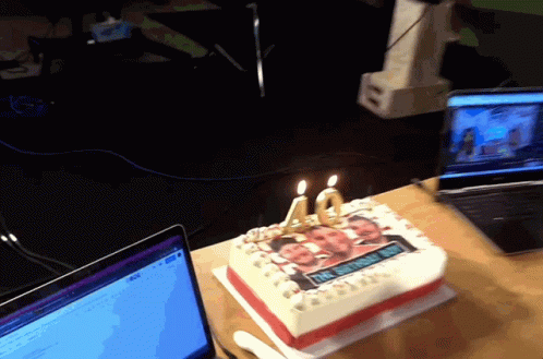 A 40Th Birthday Cake With Two Candles On It GIF