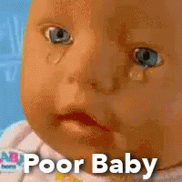 A Baby Doll With A Tear Coming Out Of It 'S Eye And The Words Poor Baby Written Below It GIF