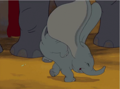 A Baby Elephant Is Crawling On The Ground With Its Trunk Outstretched GIF
