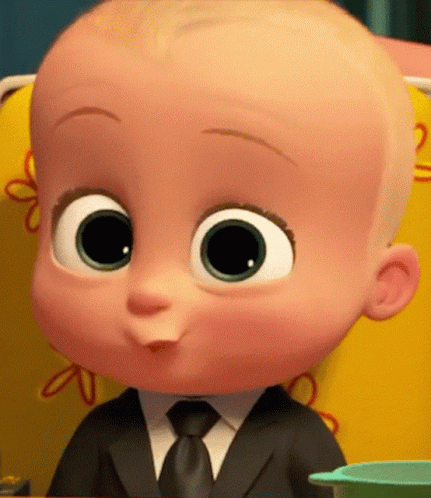 A Baby From The Boss Baby Movie Is Wearing A Suit And Tie And Sitting In A Chair . GIF