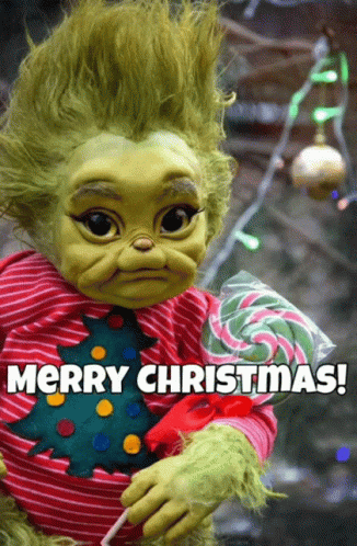 A Baby Grinch Holding A Lollipop With The Words Merry Christmas Below GIF