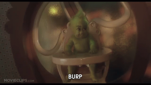 A Baby Grinch Is Sitting In A High Chair With The Words Burp Below Him GIF