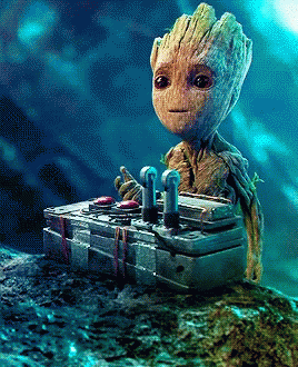 Baby Groot Sitting On Pile Of Boxes GIF