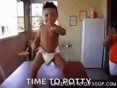 A Baby In A Diaper Is Sitting On A Pillow And Making A Funny Face . GIF