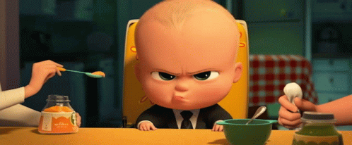 A Baby In A High Chair Is Being Fed By A Woman With A Spoon GIF