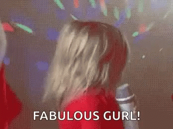 A Baby In A Santa Suit Is Holding A Microphone And Saying `` Fabulous Girl ! '' GIF