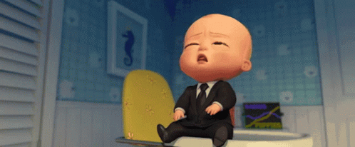 A Baby In A Suit And Tie Is Sitting On A Toilet And Crying GIF