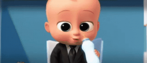 A Baby In A Suit Is Drinking Milk From A Bottle . GIF