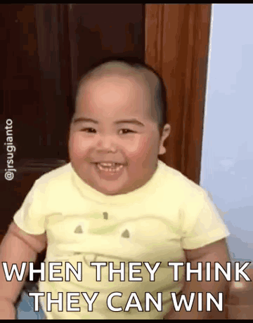 A Baby In A Yellow Shirt Is Smiling And Says When They Think They Can Win . GIF