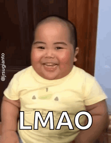 A Baby In A Yellow Shirt Says Lmao GIF