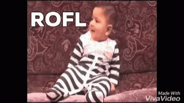 A Baby In A Zebra Print Outfit Is Sitting On A Couch With The Word Rofl Written Above Him . GIF