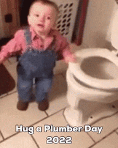 A Baby In Overalls Is Standing Next To A Toilet And Says Hug A Plumber Day 2022 GIF