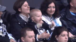 A Baby Is Being Held By A Woman In A Pittsburgh Penguins Shirt GIF