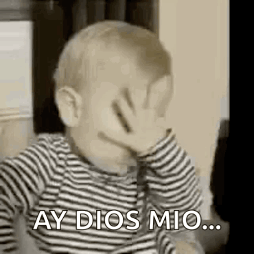 A Baby Is Covering His Face With His Hand And Saying `` Ay Dios Mio '' . GIF