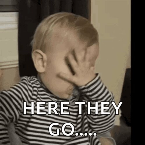 A Baby Is Covering His Face With His Hand And Saying `` Here They Go ... '' . GIF