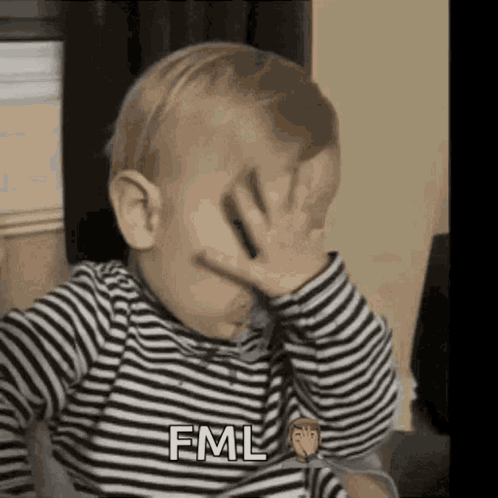 A Baby Is Covering His Face With His Hand And Says Fml GIF